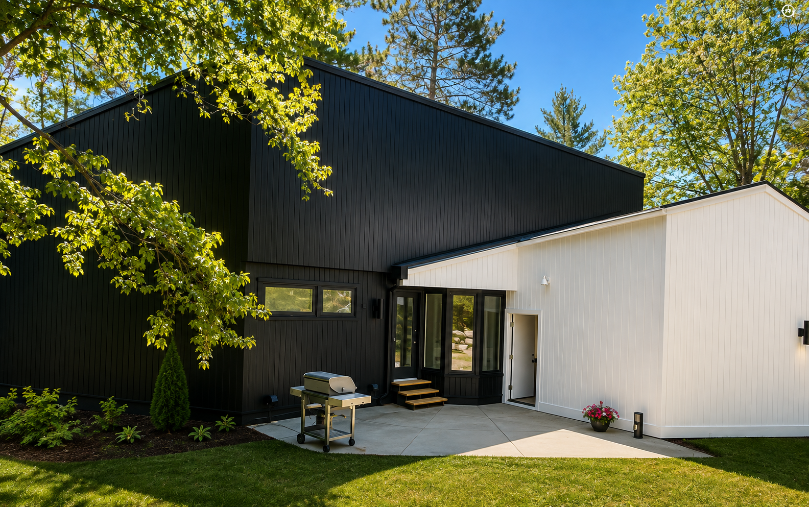 Modern home exterior with black and white board and batten siding