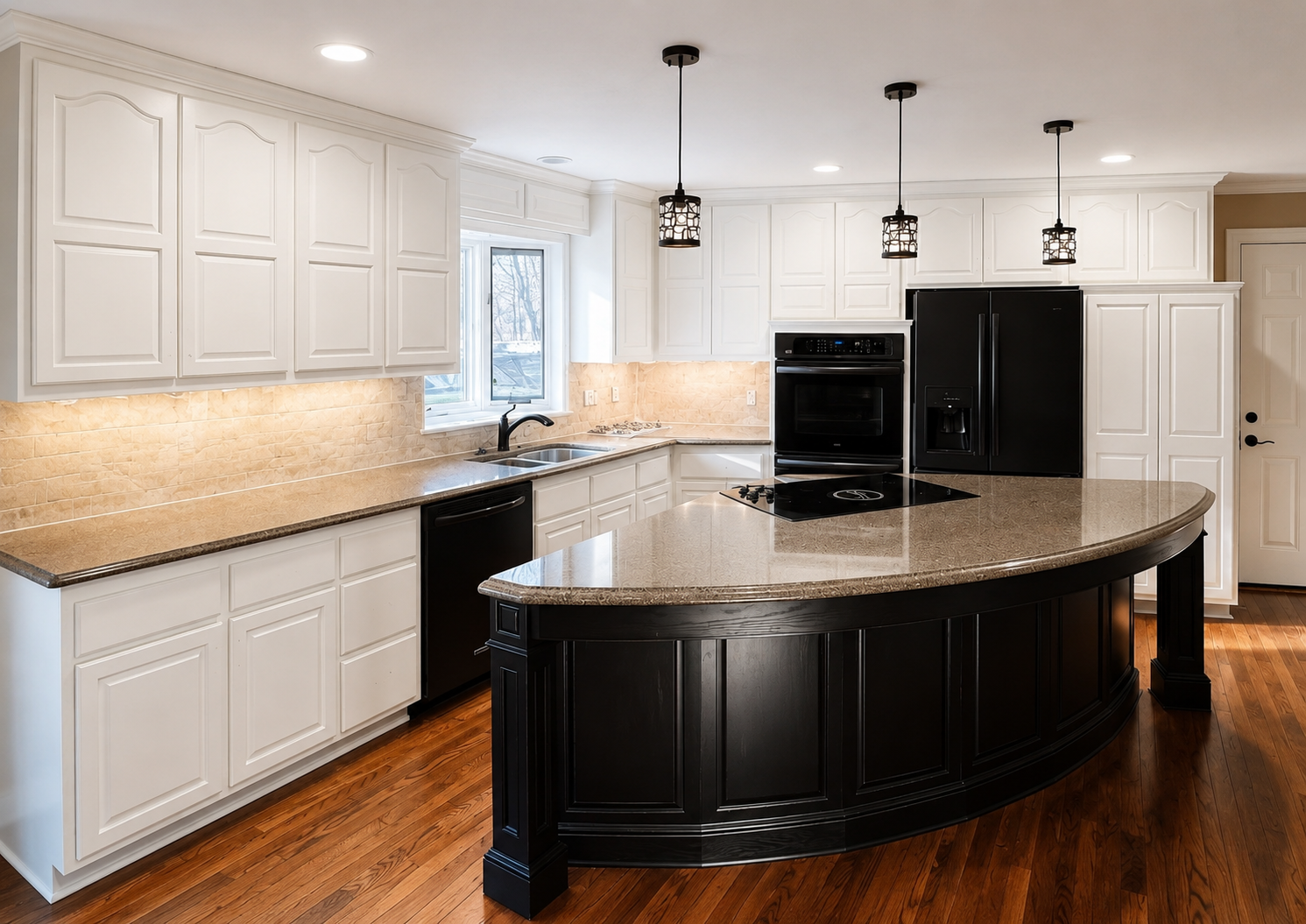 Kitchen with white repainted cabinets and a black island